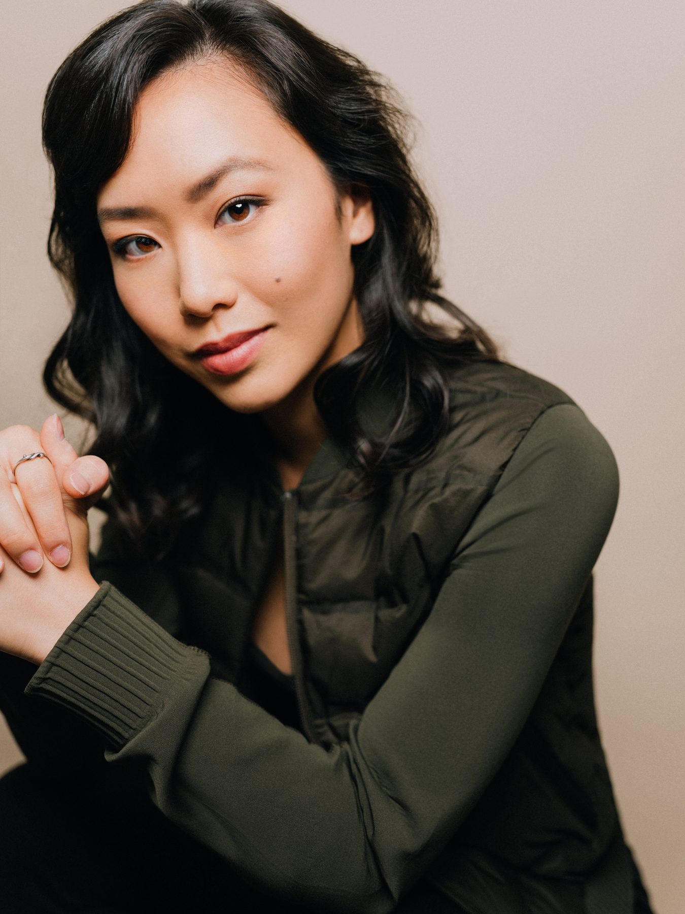 Ashley Chiu headshot — green jacket