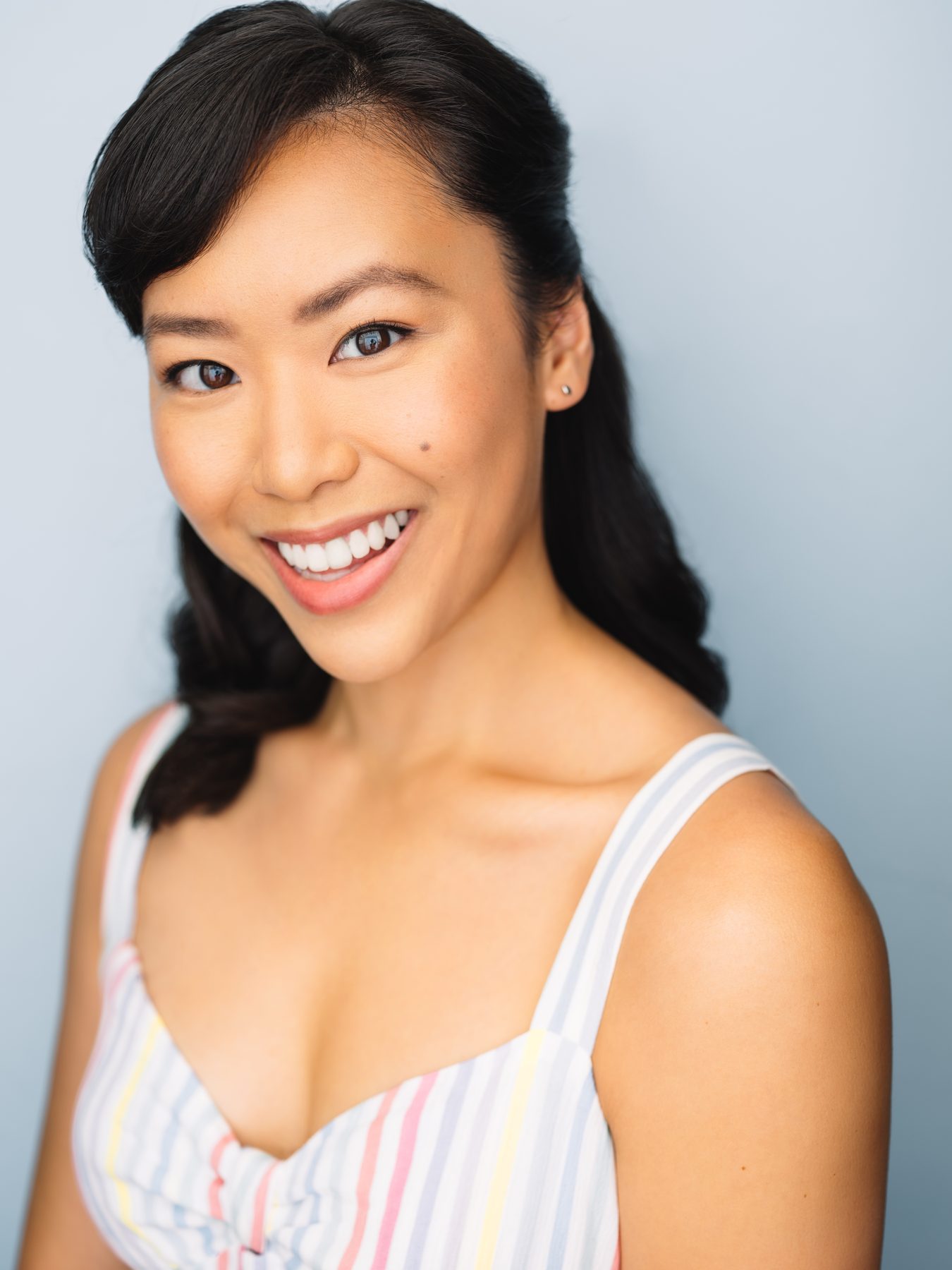 Ashley Chiu headshot — striped dress